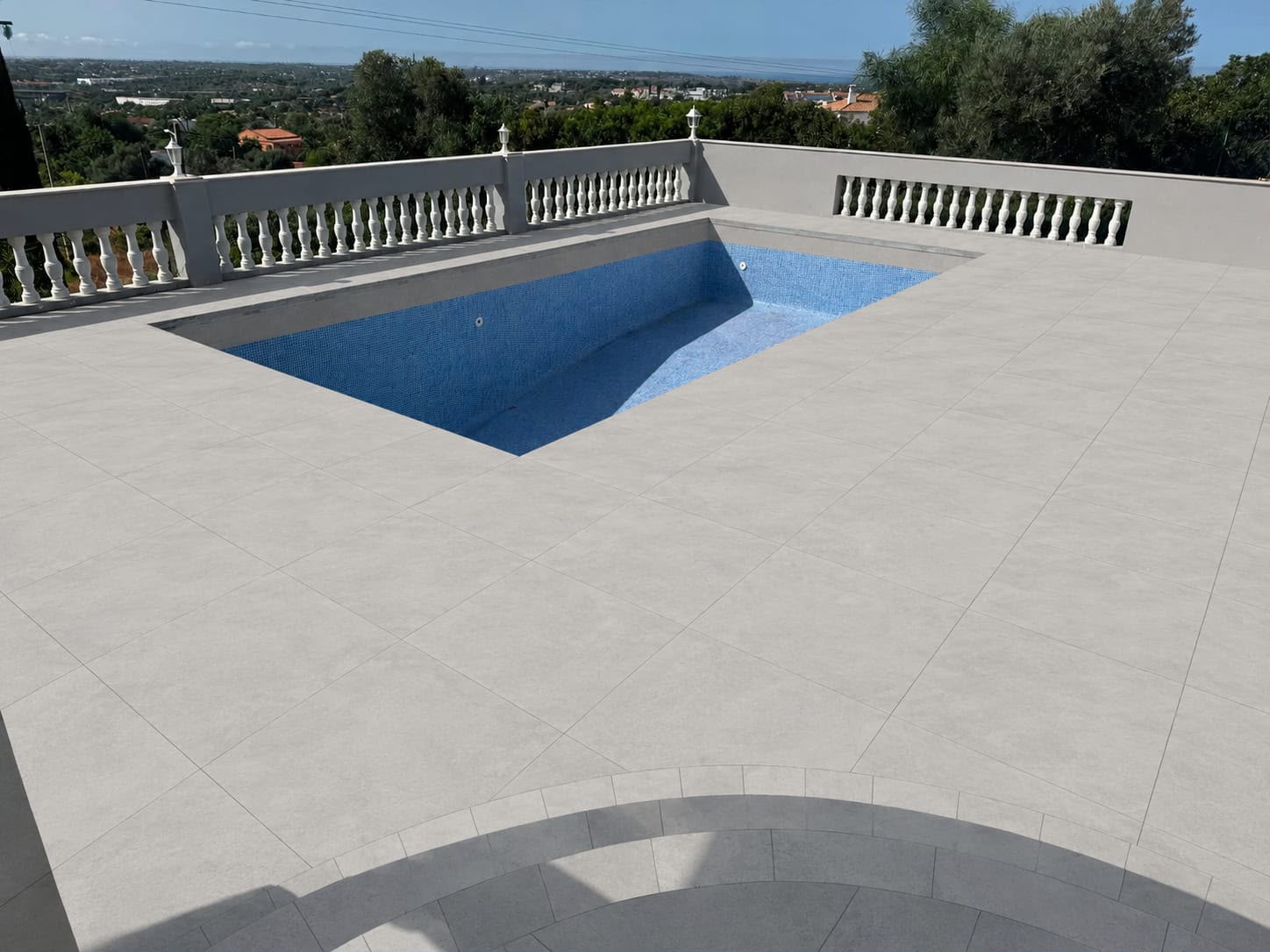 Completed tiled patio and pool area renovation