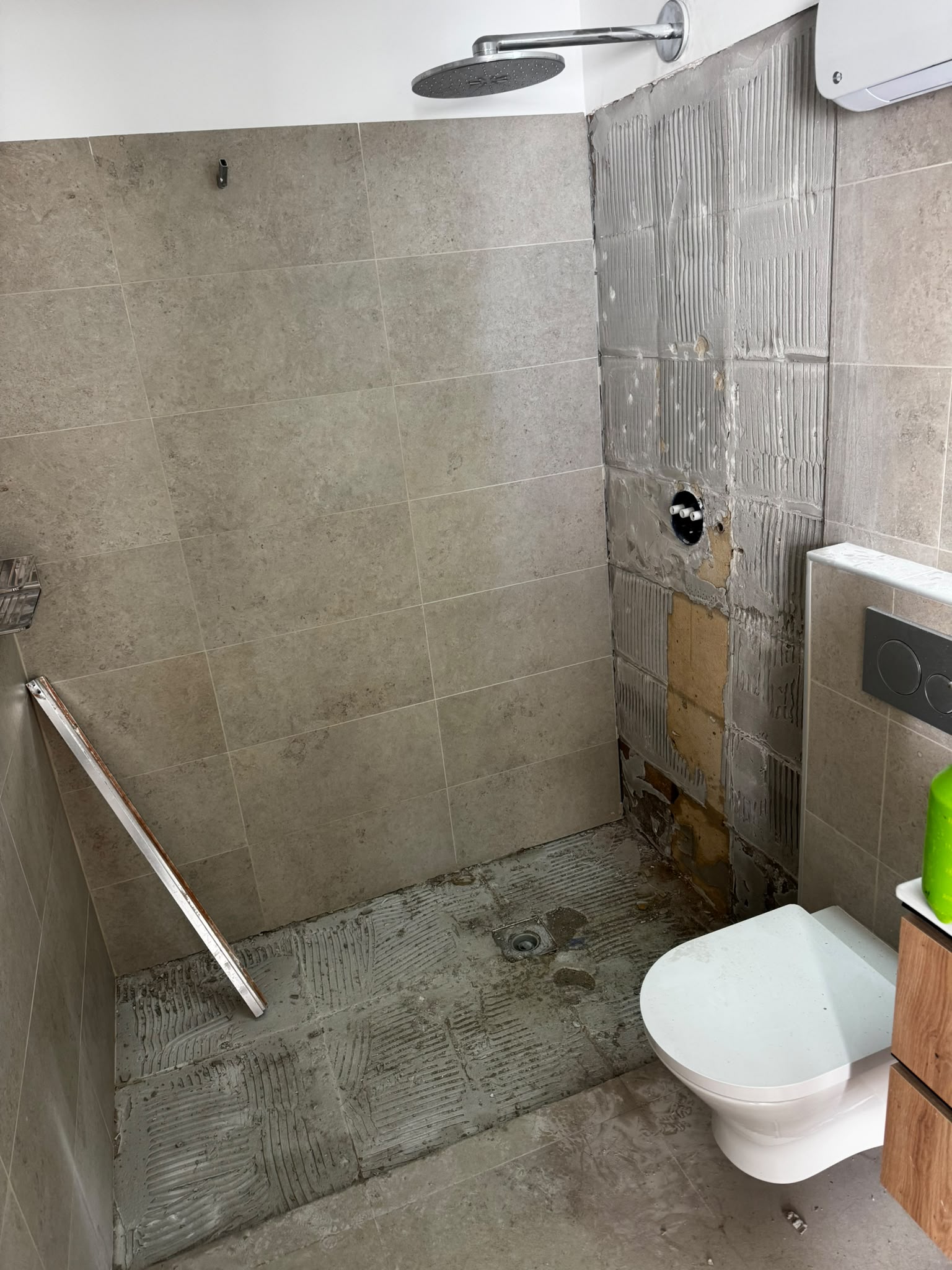 Leaking shower opened for drain and waterproofing repair