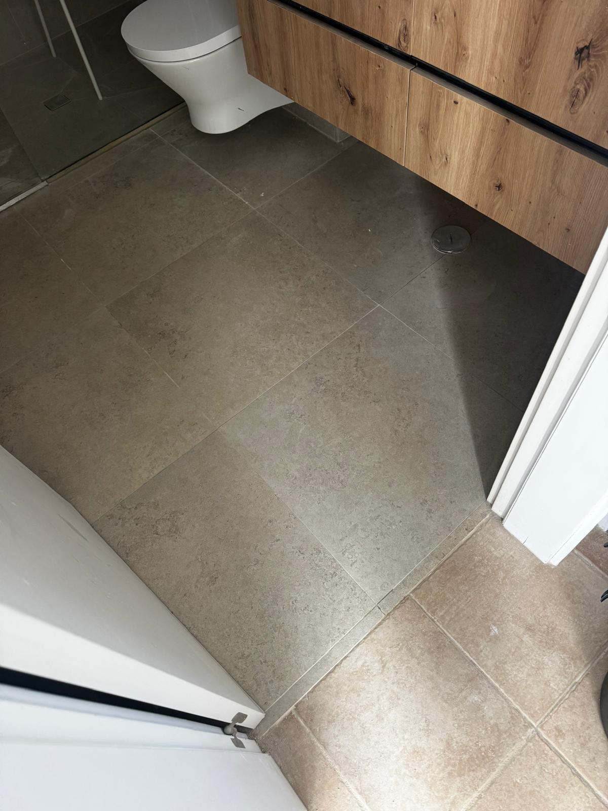 Bathroom floor retiled after waste-pipe repair